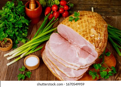 Dinning Table With Whole Baked And Sliced Ham, Vegetables And Spice. Thanksgiving Day Concept.