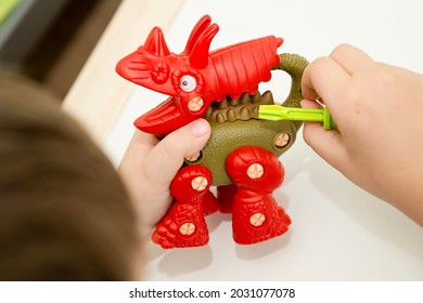 Dinosaur Constructor Made Of Plastic Parts. Fine Motor Skills. Preschool Or Special Needs Tasks. Early Education Of Children. Montessori Methodology.