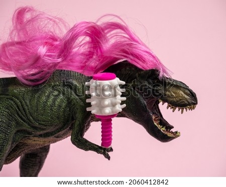 Dinosaur with long curly pink hair is holding  comb. Beauty salon. Humor concept about caring for curly hair.