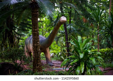 Dinosaur Model In The Jungle At Phu Kum Khao Dinosaur Excavation Site, Kalasin, Thailand