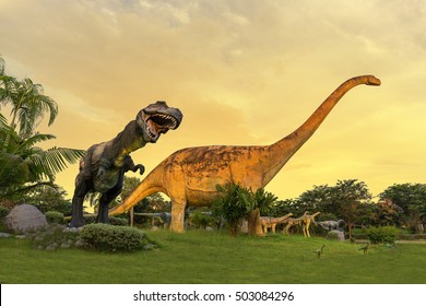 Dinosaur Statue At Phu-Wiang Forest Dinosaur Public Park In Phu-Wiang On Sunset Sky Background, Khonkaen Of Thailand