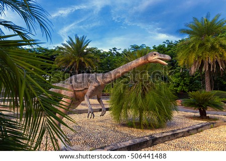 Dinosaur statue at Phu-Wiang forest dinosaur public park in Phu-Wiang on sunset sky background, Khonkaen of Thailand