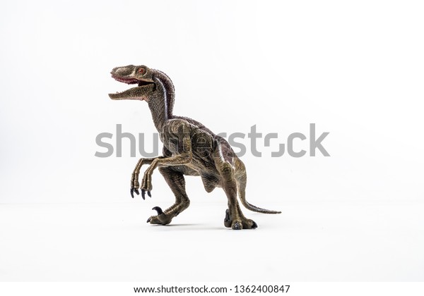 dinosaur with v on head