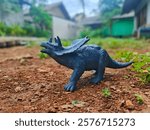 Dinosaurus on the ground with plants