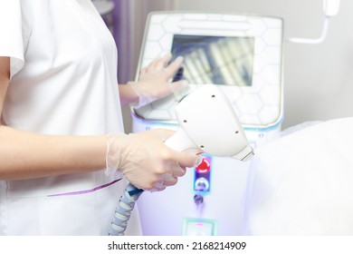 Diode Laser In The Hands Of A Beautician Close-up