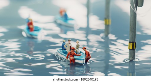 Diorama of people rescued by boats and houses flooded by floods - Shutterstock ID 1892640193