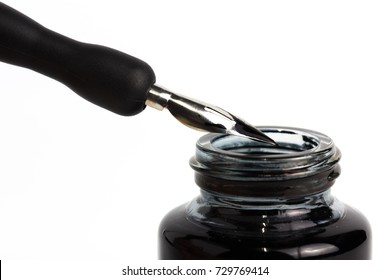 Dip Pen And Bottle Of Ink On Isolated White Background