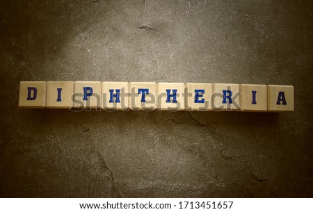 Diphtheria, word cube with background.
