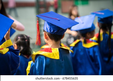 Diploma graduating little student kid outdoor closeup