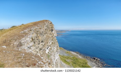 Dipping Beds Of Portland Limestone At Gad Cliff On Droset's Jurassic Coast In South-west England. 