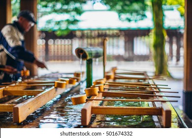 Dipping Cups At Meiji Jingu In Tokyo, Japan.