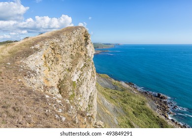 Dipping Portland Limestone Capping Gad Cliff On Dorset's Jurassic Coast In England. 