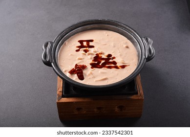 Dipping sushi into a hot cheese fondue dripping from the forks. translation“开运” meaning is means happiness