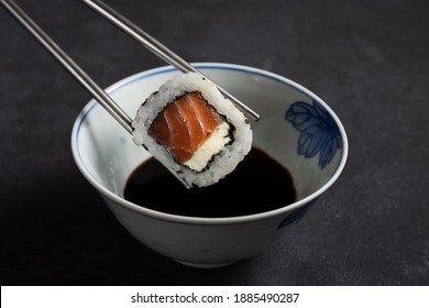 
Dipping Sushi In Soy Sauce