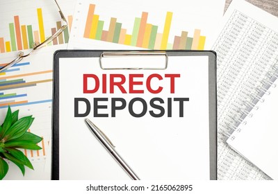 Direct Deposit Text On White Paper With Charts And Pen