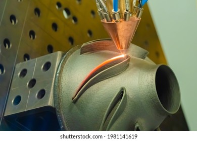 Direct metal deposition - advanced additive laser melting and powder spray manufacturing technology for repair, rebuild metal workpieces - close up. Metalworking, robotic, industrial concept