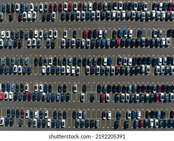 A Direct Overhead Aerial View Above A Parking Lot Of Newly Manufactured Cars, Outside Of A Manufacturing Plant.