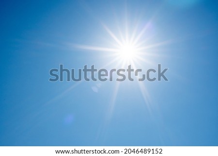 Direct ray of the sun in the blue sky