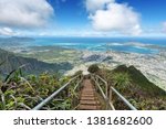 Direct shot at sun from a ridge trail on Oahu, Hawaii overlooking Kaneohe, Kailua and the windward side of the island on Haiku stairs