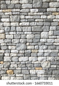 Direct View Of Decorative Natural Cobble Stone Wall With Different Shades Of Grey And Sizes, Shadow Gap. Natural Texture And Form. Exterior Wall Covering. 