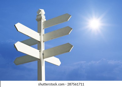 direction sign with blank spaces for text on beautiful sunlight  background - Shutterstock ID 287561711