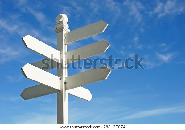 direction sign with blank spaces for text on\
beautiful sky\
background