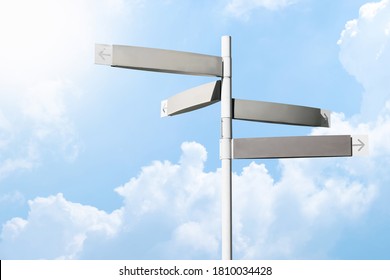 Direction signpost with cloudy blue sky background. Many blank direction road sign with copy space. - Shutterstock ID 1810034428