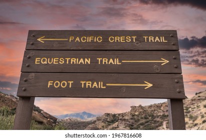 Directional sign pointing towards the Pacific Crest, Equestrian and Foot Trails in Los Angeles County, California.  