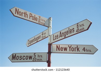 Directions Sign Post Against Blue Sky