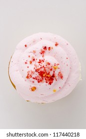 Directly Above Photograph Of A Cupcake On A White Background.