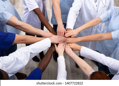 Directly Above Shot Of Medical Team Stacking Hands Together At Hospital