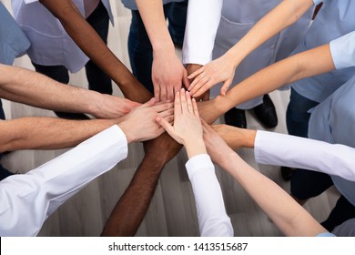 Directly Above Shot Of Medical Team Stacking Hands Together At Hospital - Shutterstock ID 1413515687