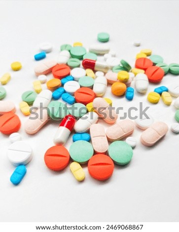 Directly above shot of multi colored medicines on white background.