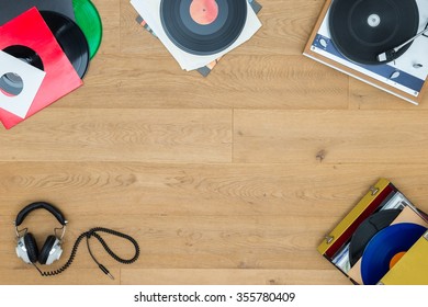 Directly Above Shot Of Records With Turntable On Wooden Table