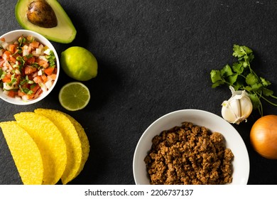 Directly Above Shot Of Tortillas, Meat, Avocado, Lemon, Cilantro, Onion, Tomato And Garlic On Table. Unaltered, Taco, Ingredients, Food, Preparation And Mexican Food Concept.