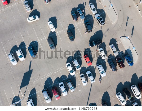 directly above view of cars abstract parked on the\
asphalt lot 