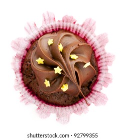 Directly Above View Of Chocolate Cupcake With Frosting And Stars.