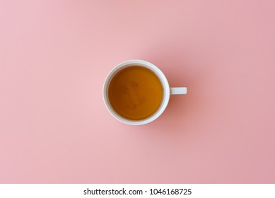 Directly Above View Of Tea In Cup On Pink Background