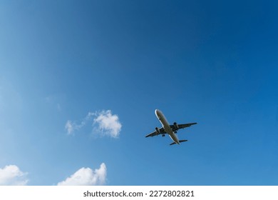 Directly Below Shot Of Airplane Flying In Sky