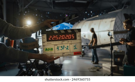 Director Filming Ad Shoot With Astronaut Fixing Satellite. Actor Floats on Rope Against Digital Earth Backdrop. Behind-the-scenes of Commercial Production. - Powered by Shutterstock