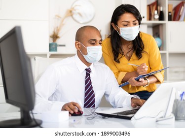 Director In Protective Medical Mask Gives Instructions To Secretary In Office