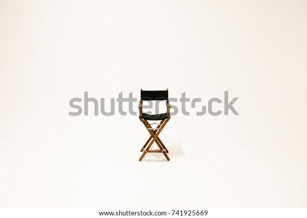 Directors\
chair isolated on a white background. Space for text.\
Vacant\
chair. The concept of selection and\
casting.