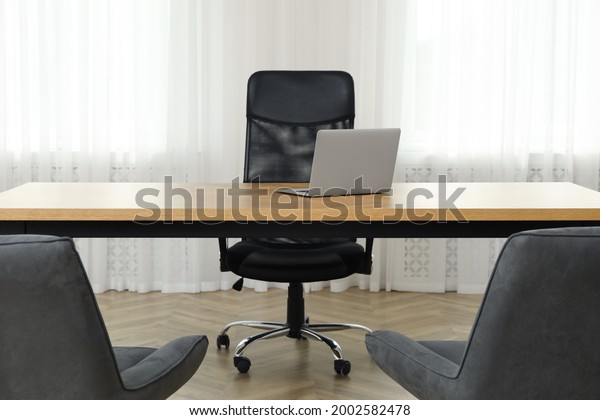 Director's office with large wooden table and
comfortable armchairs. Interior
design