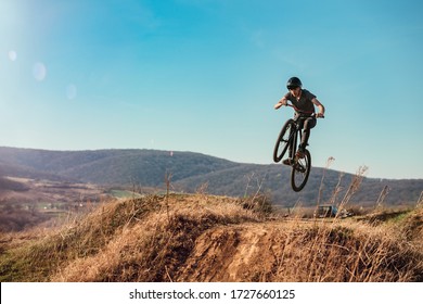 Dirt Bike Rider Jumping In Bike Park On Mountain Bike