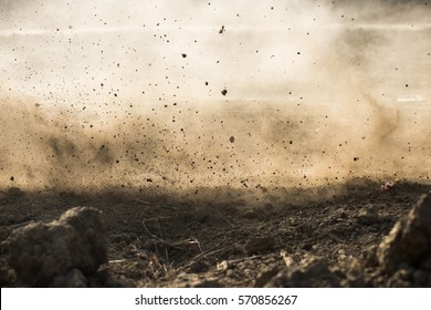dirt fly after motocross roaring by - Shutterstock ID 570856267