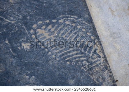 dirt footprint on rubber surface
