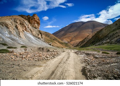 Dirt Gravel Mountain Road Through The High Central Tibetan Plateau, Tibet, China