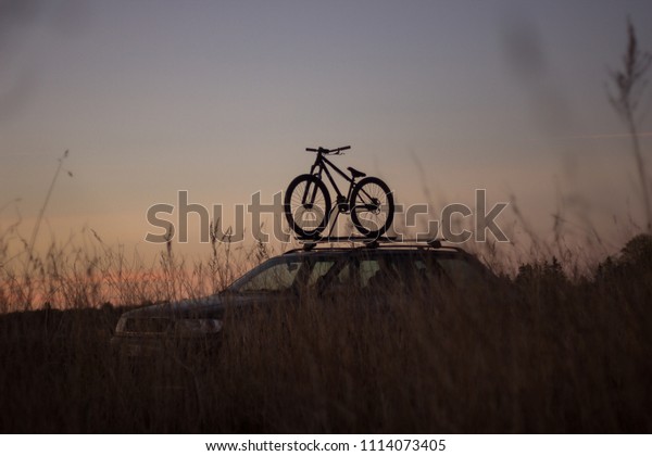 Dirt jump bike in\
sunset