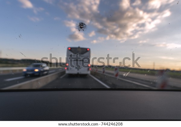 Dirt on the windshield of a vehicle\
and a rock fall lead to poor visibility and increase the risk of\
accidents. There is a risk of a rear-end\
collision.\
