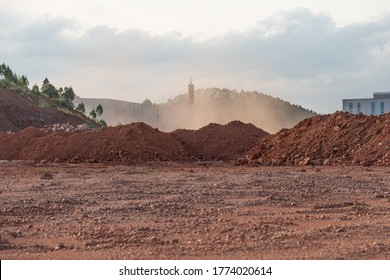 Dirt piles and dust from the wind at the construction site - Shutterstock ID 1774020614